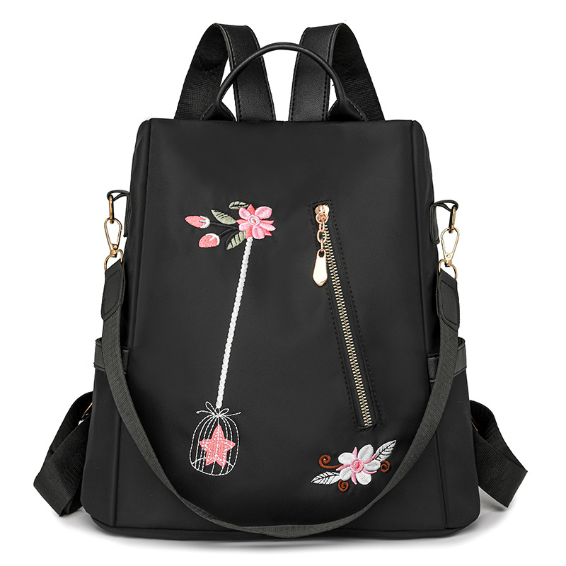 Mochila antirrobo de gran capacidad para mujer con bordado de flores de nuevo estilo Mochila de viaje de ocio de nailon antiagua de moda al por mayor