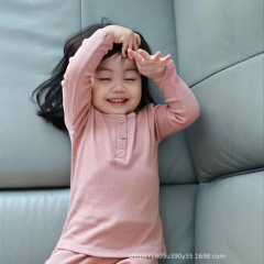 子供の秋の服の秋のズボンのスーツの純粋な綿の赤ちゃんのプリントの家庭服の男の子の女の子の分体の保温の下着