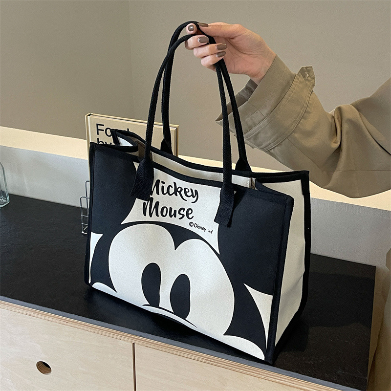 2024 bolsa de lona de las mujeres de primavera nueva moda bolsa de hombro de gran capacidad bolsa de viaje portátil de dibujos animados bolso de la momia