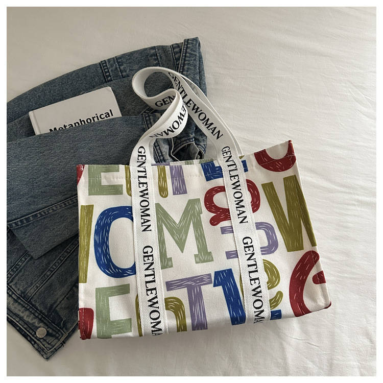 Large-capacity letter canvas bag 2025 new style ins printed versatile shoulder bag for commuting and portable ladies' tote bag undefined
