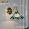 Blue tent, brass sconce