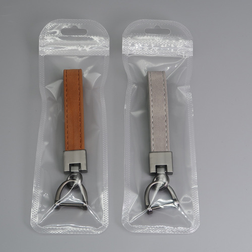 Cross-border best-selling simple men's waist pendant, creative embossed logo anti-lost pendant, suede car keychain