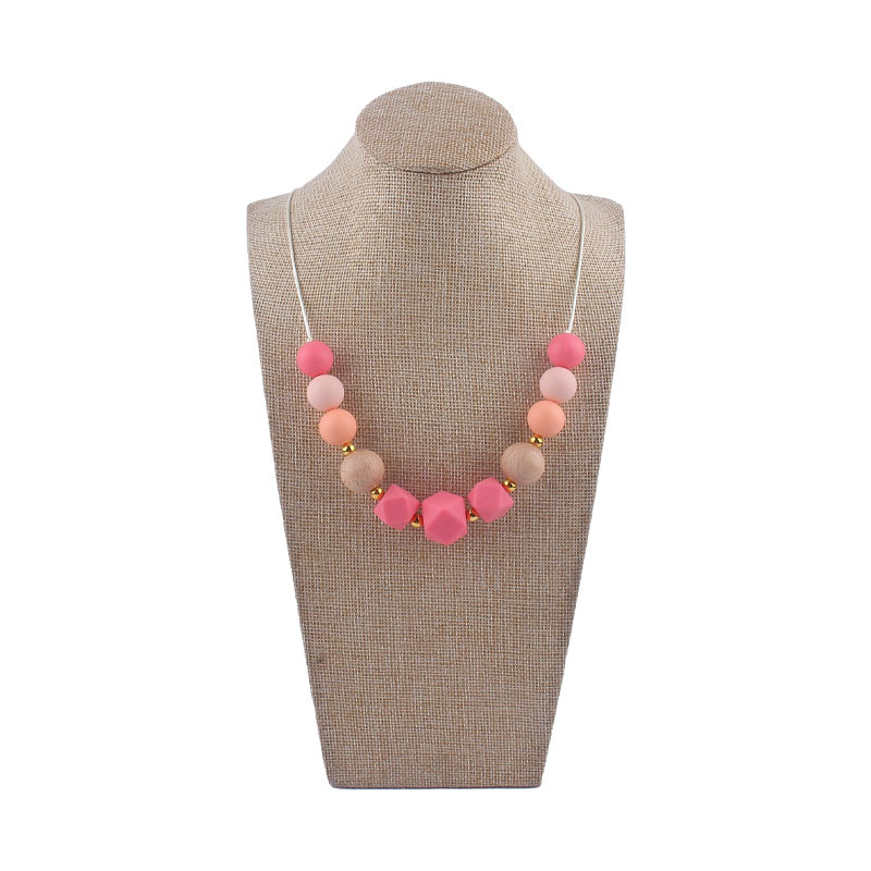 Los nuevos bebés de contraste de color de silicona octogonal mordedor collar de los bebés mordedor palo masticable colgante collar