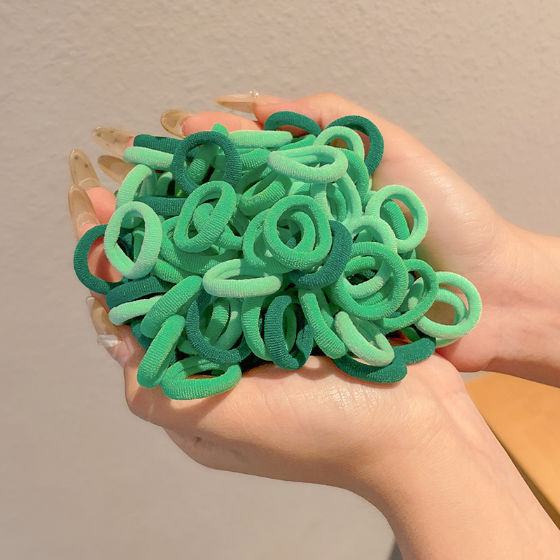 La alta elasticidad de los niños femeninos pequeños negros simples de la banda de goma no duele la banda de goma del pelo Tamaño pequeño cubierta de cuero cuerda de lazo de pelo banda de pelo tocado