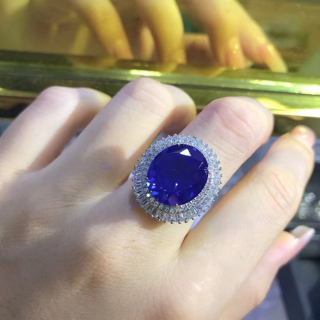 Comercio exterior transfronterizo exclusivo para anillo de zafiro sintético de alta calidad corte oval con incrustaciones de joyería de plata de 15 quilates