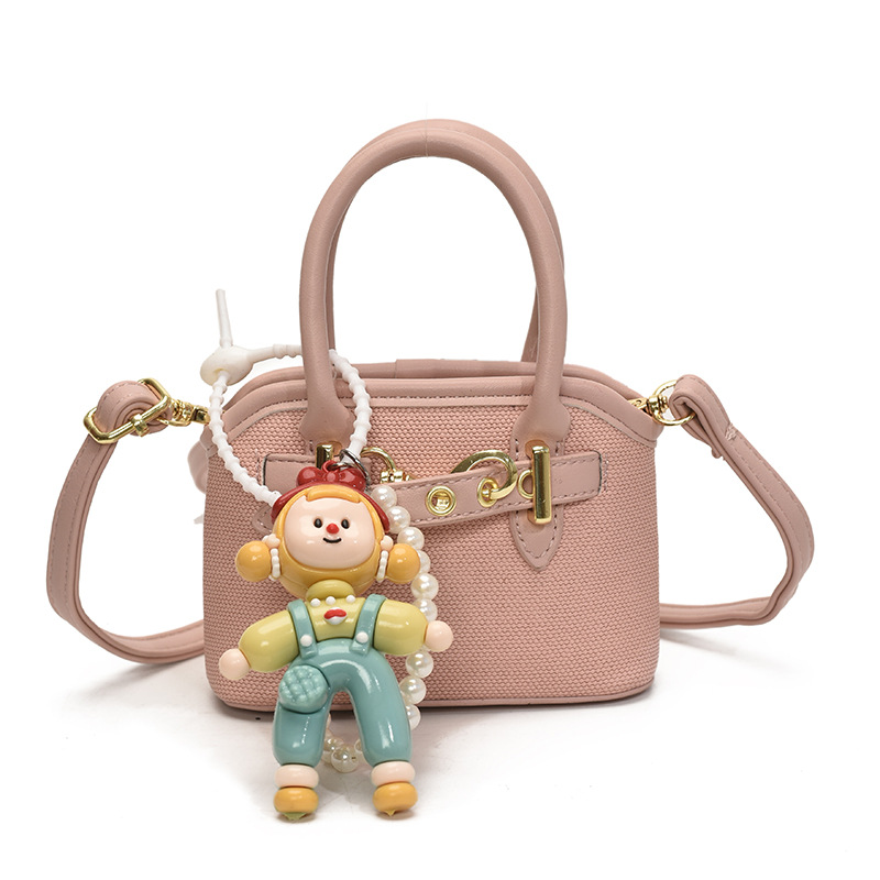 Bolsos de mano para niños lindos colgantes extranjeros mini bolsos de hombro para niños y niñas de color sólido simple bolsos de conchas de niños de moda