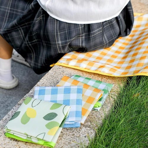 Foldable, waterproof, and moisture-resistant outdoor camping lawn mat—perfect for spring outings, portable picnic mats, and music festival grassy areas.