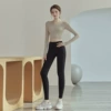 Apricot breast pads, black trousers