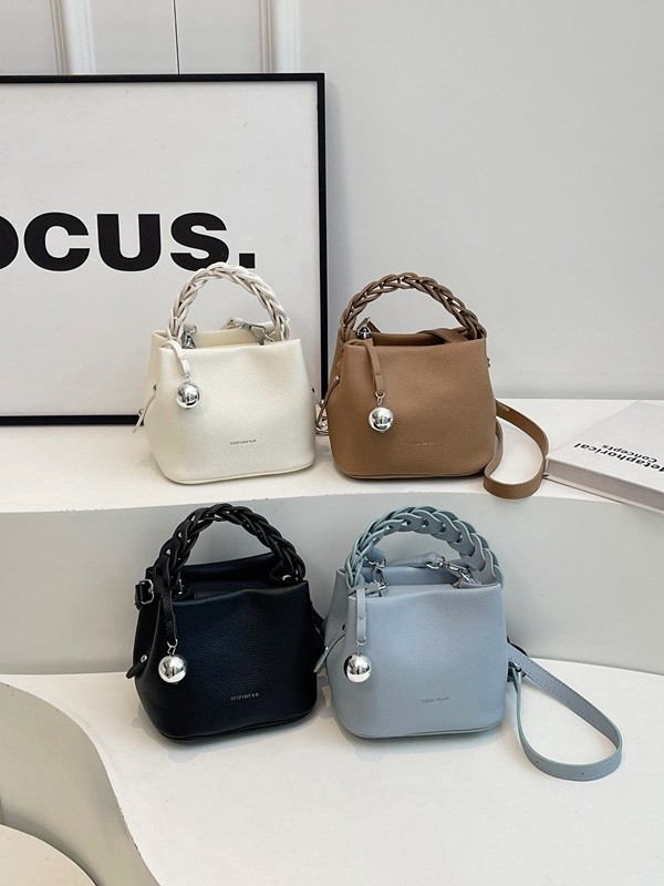 Bolso de mujer 2026 verano nuevo tejido a mano bolso de cubo de moda simple bolso de hombro mochila
