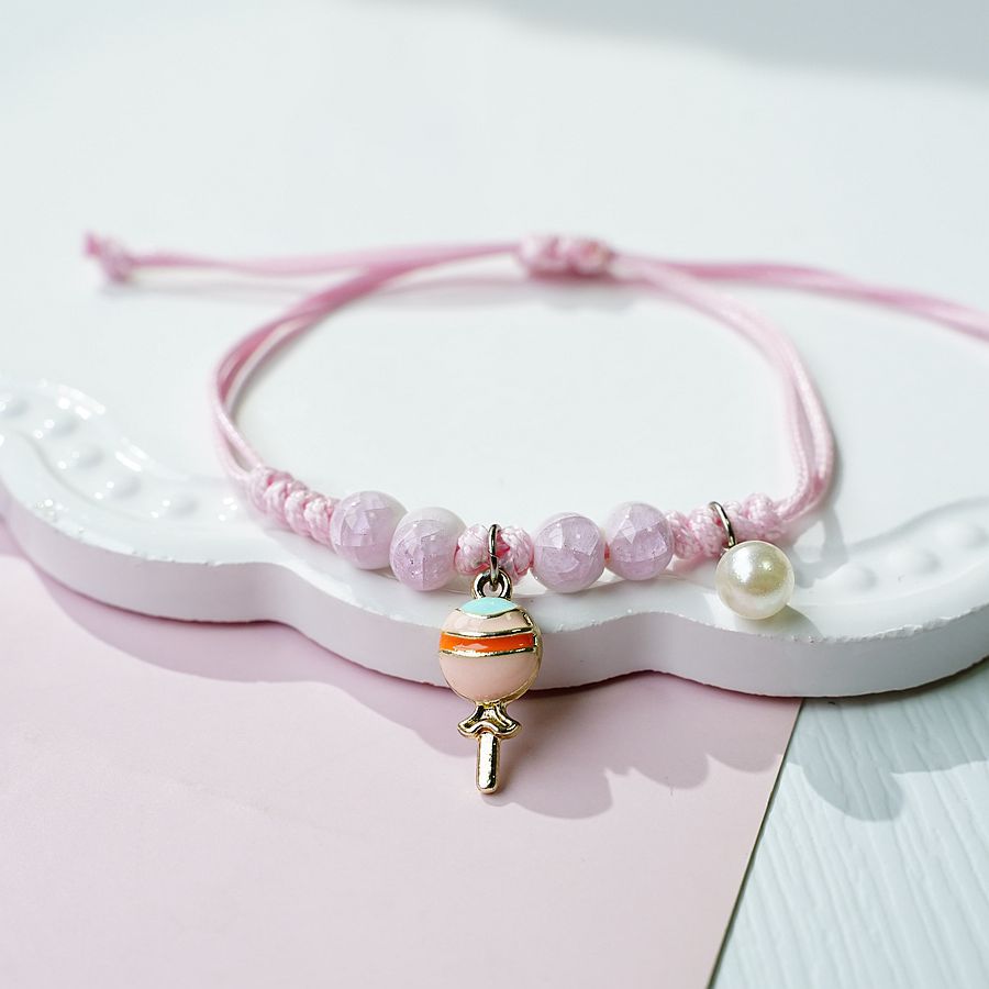 Versión coreana creativa de la literatura y el arte canela perro pulsera de cerámica femenina versátil popular pareja pequeño regalo fresco arco iris caramelo