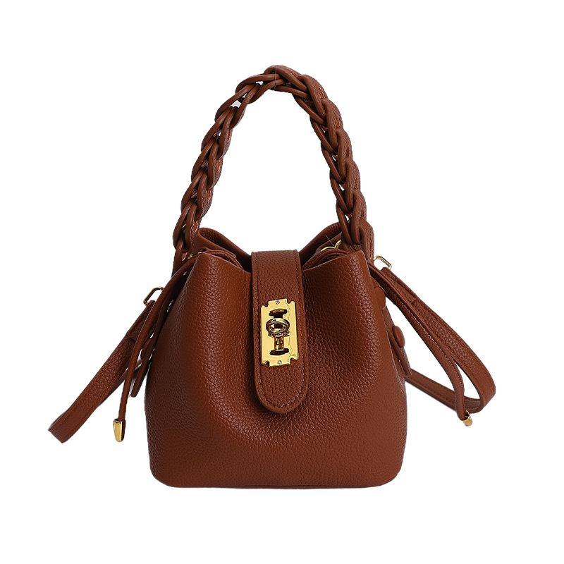 Bolsos de balde portátiles de alta calidad para mujeres 2026 verano nuevo lichi estampado viaje diario ocio versátil mochila