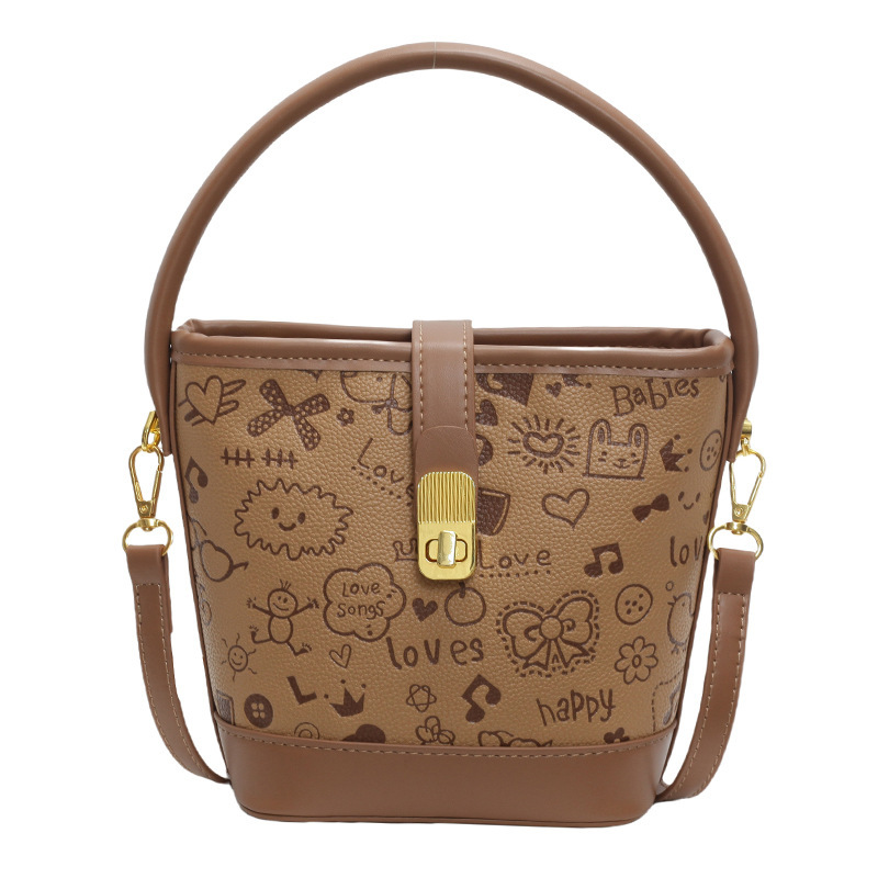 Bolsos populares de alta gama para damas 2024 nueva textura para trabajar bolso de cubo de mensajero de cercanías de nicho marrón