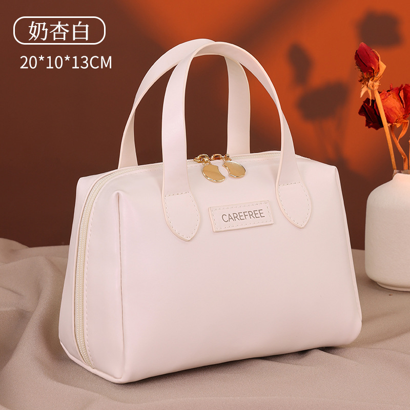 Luz de lujo francés pequeño bolso de maquillaje portátil multifuncional de alta calidad sensación de viaje bolsa de maquillaje portátil de mujer