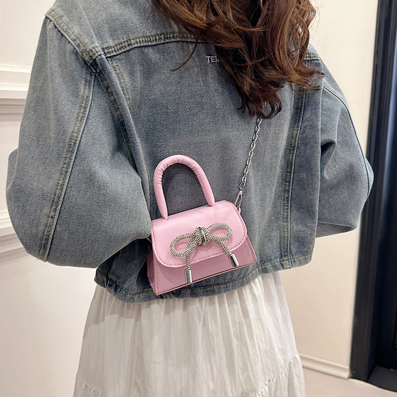 Moda al por mayor arco mini bolso mujer 2025 nuevo mochila bolso de hombro universal bolso de moda mujer