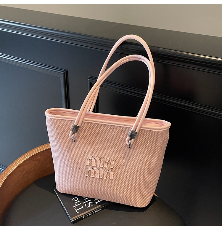 Bolso de alta gama para mujer de gran capacidad 2025 nuevo estilo primavera y verano diseño de nicho bolso de mensajero bolso de cubo portátil para mujer