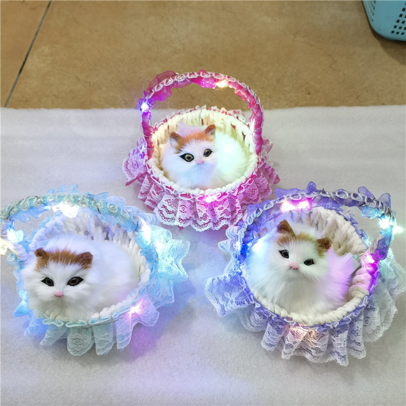 シミュレーション花かご猫は猫動物シミュレーション毛皮の置物観光地区の露店で子供のおもちゃのプレゼントを販売します。|undefined