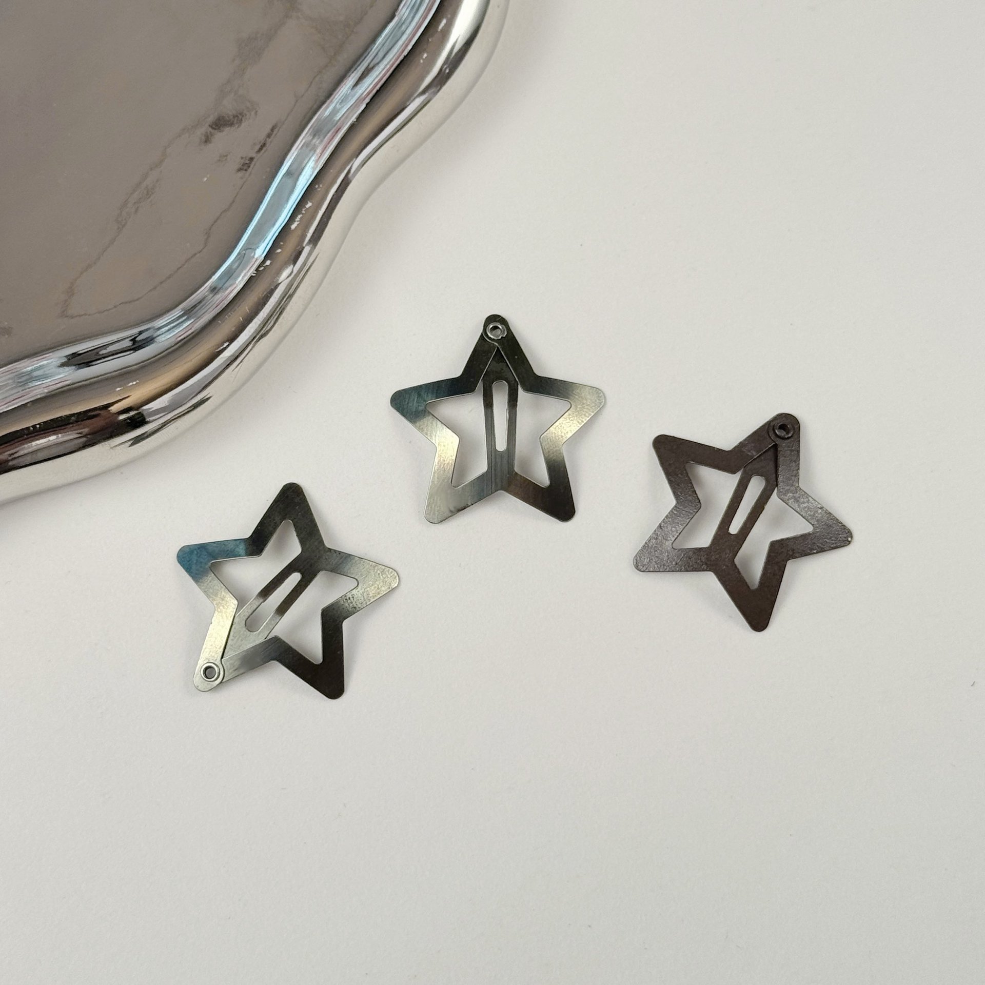 Cross-border hot-selling star-shaped hair clips with enamel finish, available for wholesale, metal hair accessories