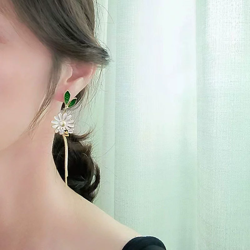 Design asymmetrical earrings, trend of season, flowered