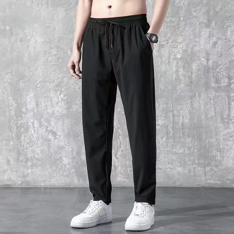 En stock pantalones de invierno de los hombres forrados de lana engrosada pantalones casuales estilo coreano de moda recta suelta más el tamaño de todos los deportes a juego hombres