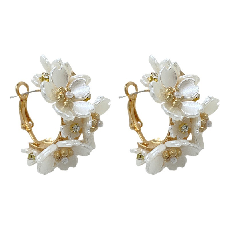 Exquisitos pendientes de flores de lujo ligeros de alto grado exquisitos pendientes de flores de lujo ligeros de Corea del Sur pendientes de pétalos