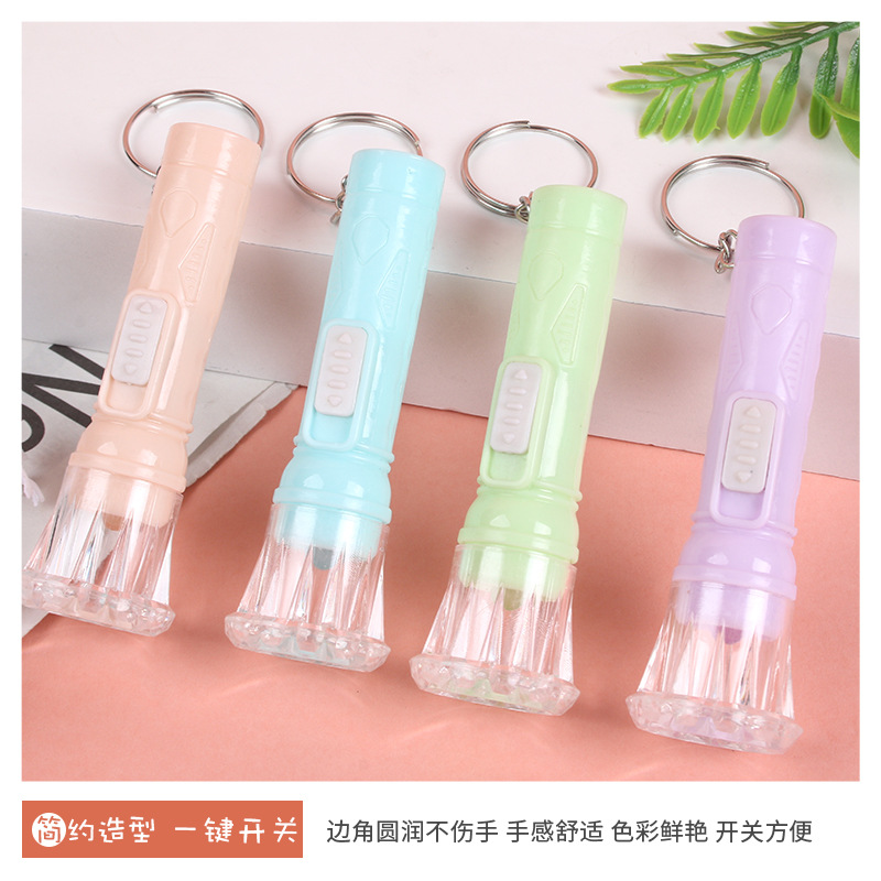 Llavero de linterna Mini linterna pequeña de plástico Iluminación de linterna Llavero luminoso Accesorios al por mayor