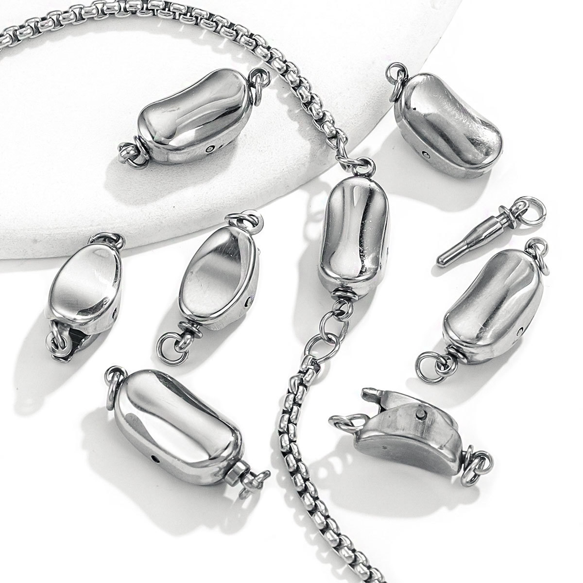 Botón de lingote de acero de titanio Pulsera de maní de acero inoxidable Botón pulido fino Botón de guisante Accesorios de joyería de bricolaje Gota de agua europea y americana