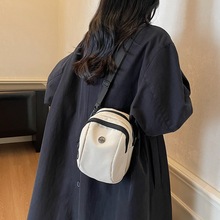 双肩包女新款2026新款迷你手机袋轻便手提简约女包洋气帆布小包包