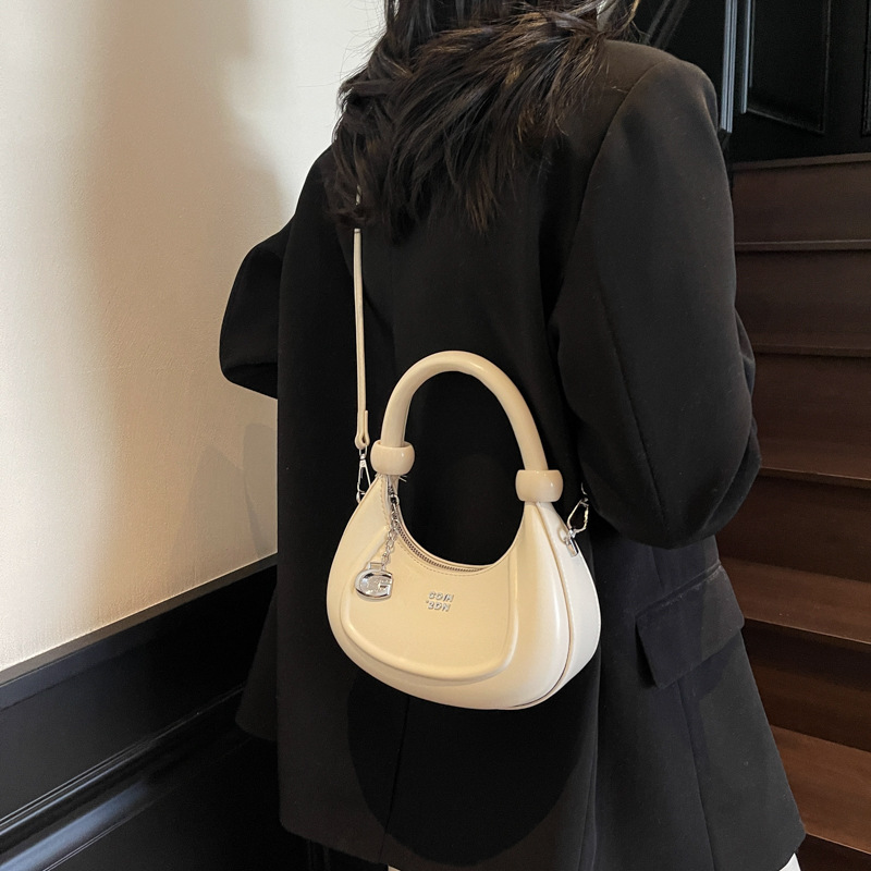 Bolsos de diseño de nicho de tendencia transfronteriza para mujer 2025 nuevo bolso de hombro retro salvaje bolso de axila de moda occidental