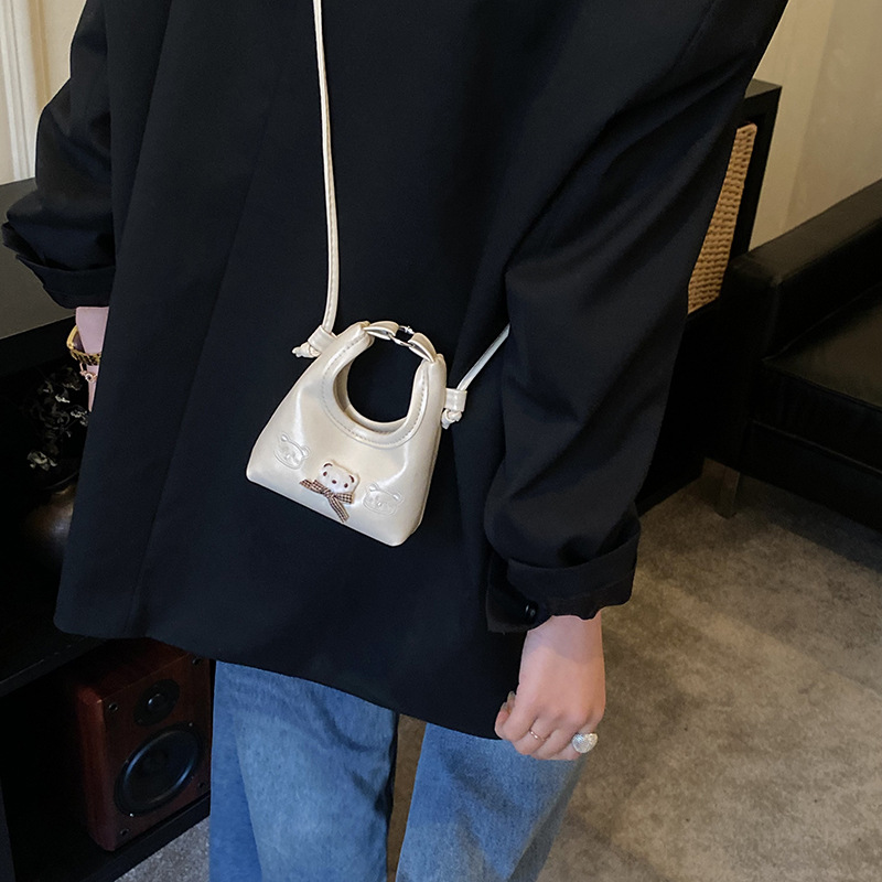 2026 nuevo bolso infantil de dibujos animados osos mini bolso de mano bebé adorable bolso de accesorios de niña pequeña