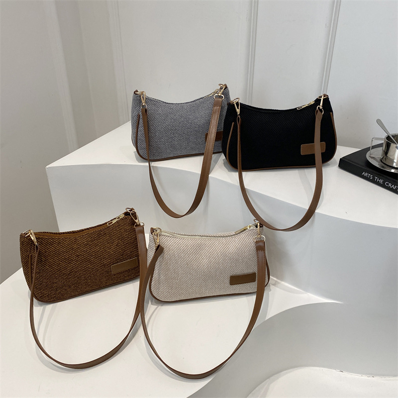 Elegante y simple temperamento nicho bolso de hombro casual 2025 primavera nuevo bolso de mochila de mujer versión coreana bolso popular