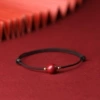 Black round beads, cinnabar