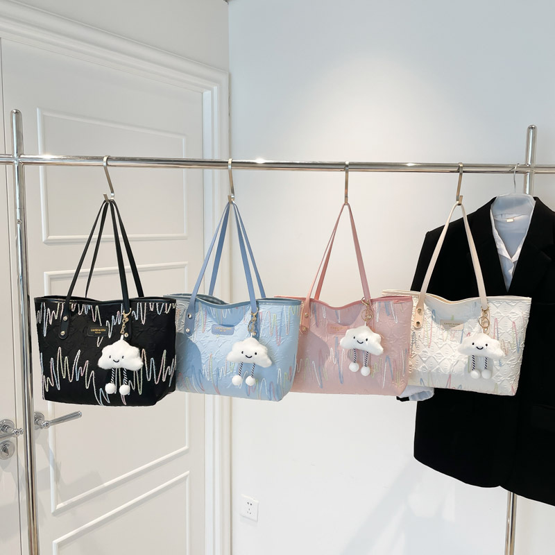 Bolsas de tela de clase de estudiantes para mujeres 2025 nuevo hombro brazalete estriado de gran capacidad de viaje ocio bolsa de mano