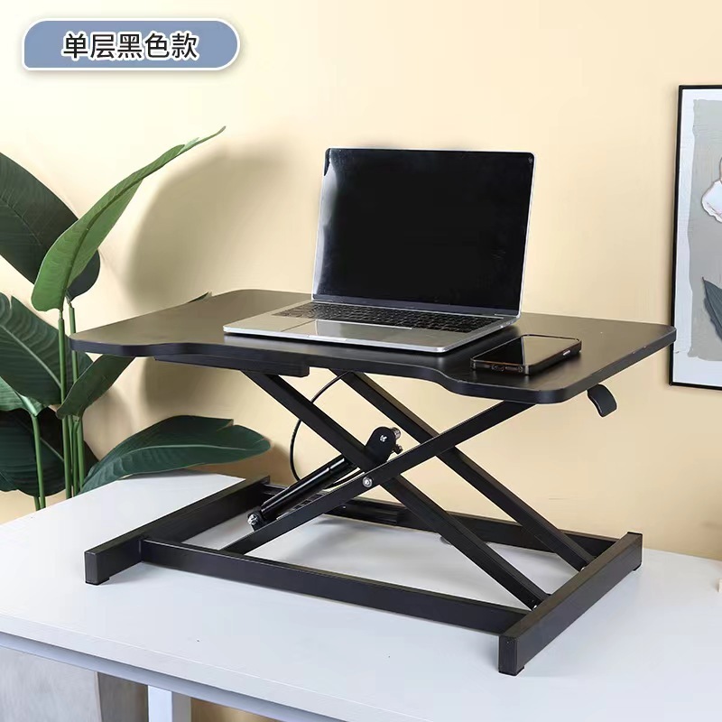 気動机の上のコンピュータの机は立式の事務室の台の上に立って高くなるノートの折り畳みの机で机を昇降することができます。|undefined