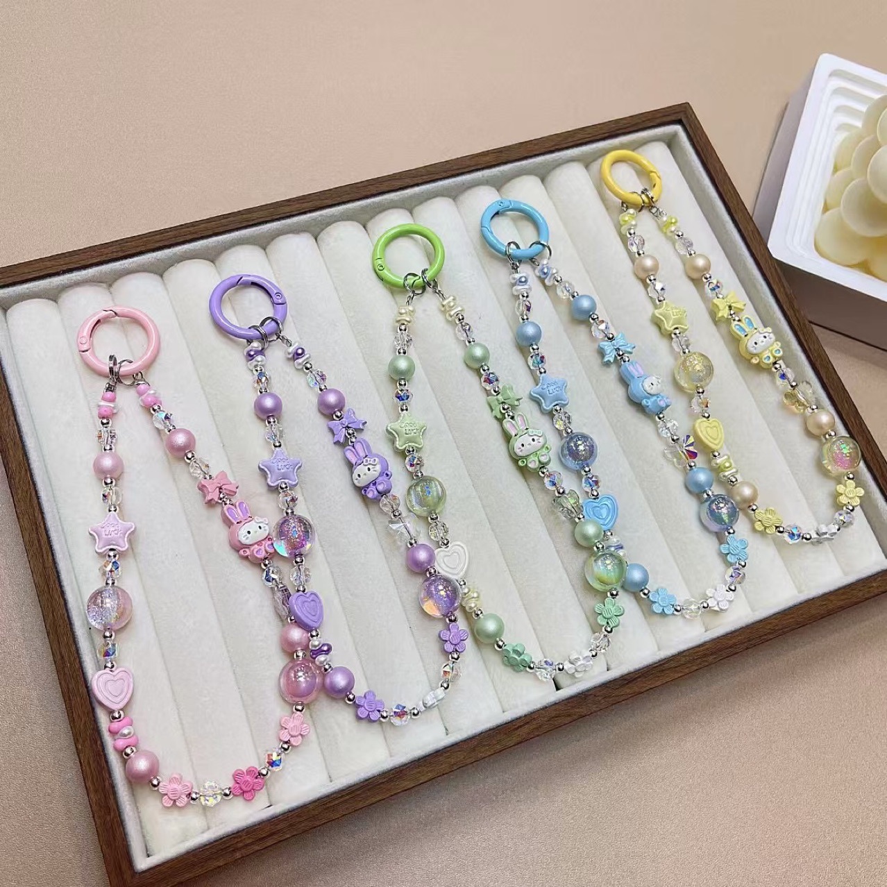 Creativo de dibujos animados KT conejo aleación cadena teléfono móvil cordón muñeca nuevo DIY hecho a mano cuentas estrella de cristal colgante de equipaje