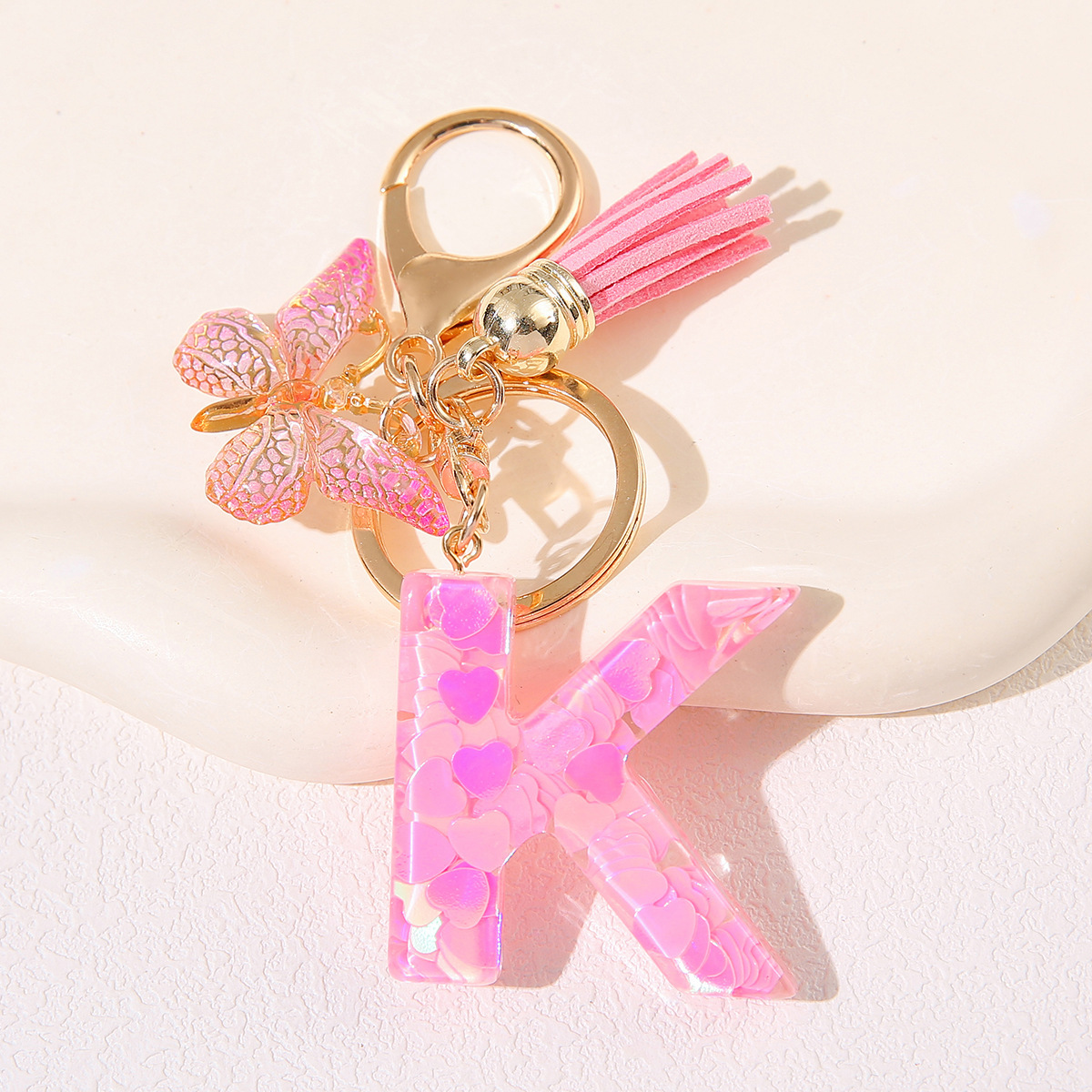 Nuevo rosa damas letras A-Z llavero de goteo de goma sequilla amor letras bordas mariposa llavero transfronterizo