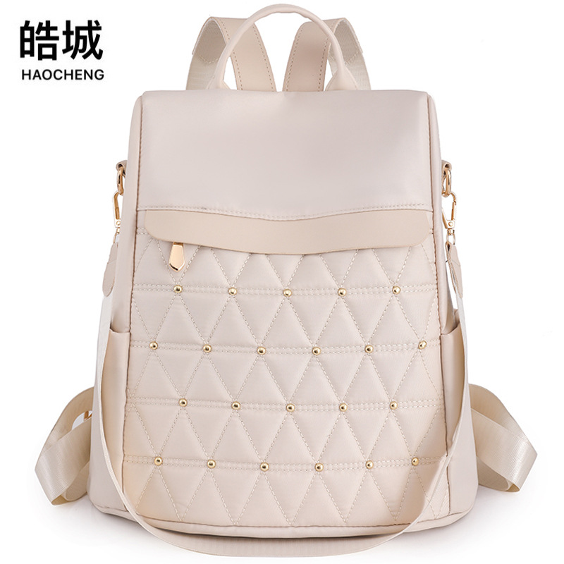 Spot wholesale 2023 nueva mochila casual para mujer de nailon moda rombo antirrobo mochila de viaje de gran capacidad