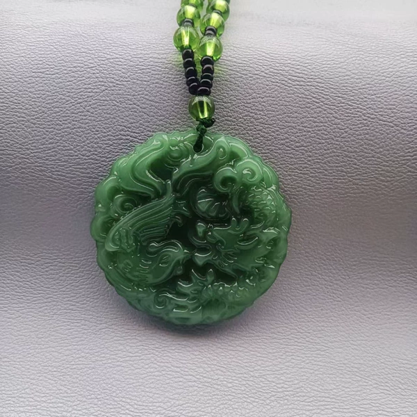 Green pendant, dragon and phoenix