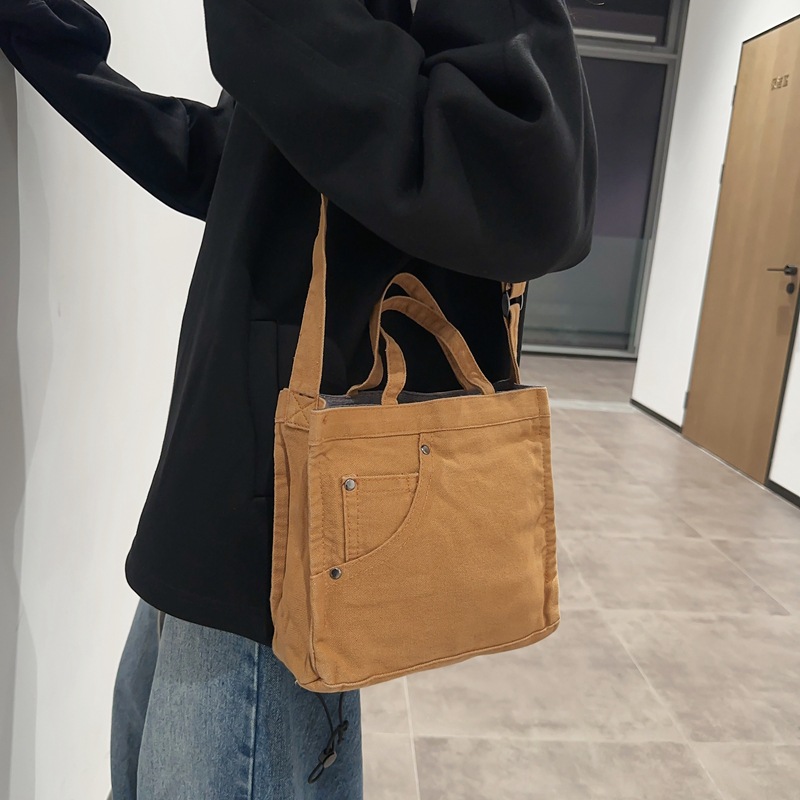 Bolso de lona lavado para mujer 2024 nuevo bolso de hombro minimalista literario de moda todo fósforo bolso diagonal portátil al por mayor