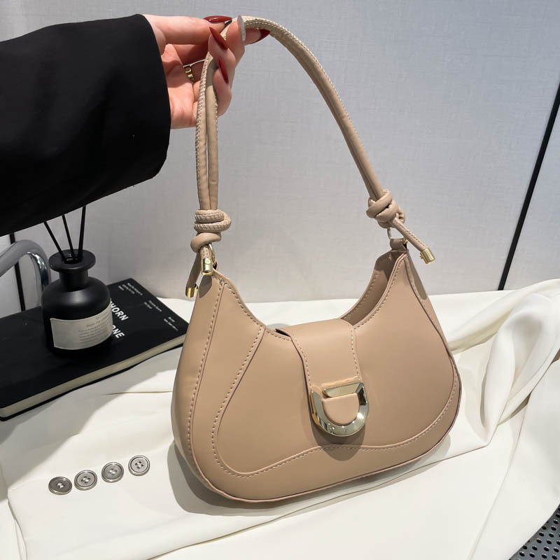 Una pieza de moda y simple bolso de palo francés para mujer 2025 bolso de axilas de viaje transfronterizo bolso de mensajero de hombro de todo fósforo