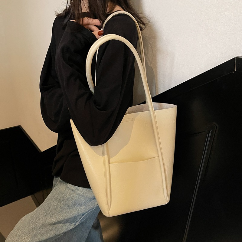 Bolsos de balde transfronterizos para niños 2024 nuevos bolsos de mujer de alto nivel retro bolsos de hombro bolsos de mano simples casuales