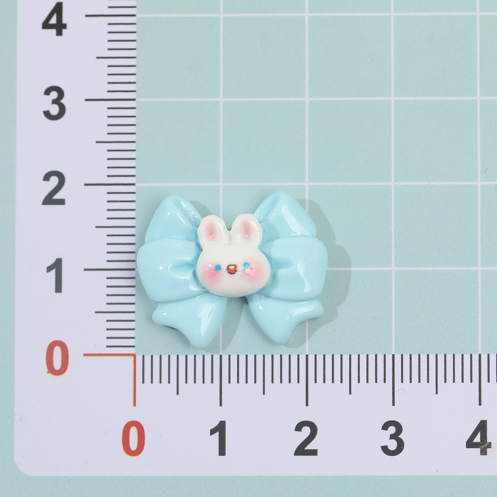 Dibujos animados macaron mariposa conejo resina accesorios DIY crema pegamento horquilla accesorios para el cabello teléfono móvil Shell material hecho a mano al por mayor