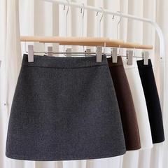 グレーの毛の半身のスカートの秋冬の女性のa字の短いスカートの太っているmmの冬の厚い半分のスカートの黒色の高い腰はヒップのスカートを包みます