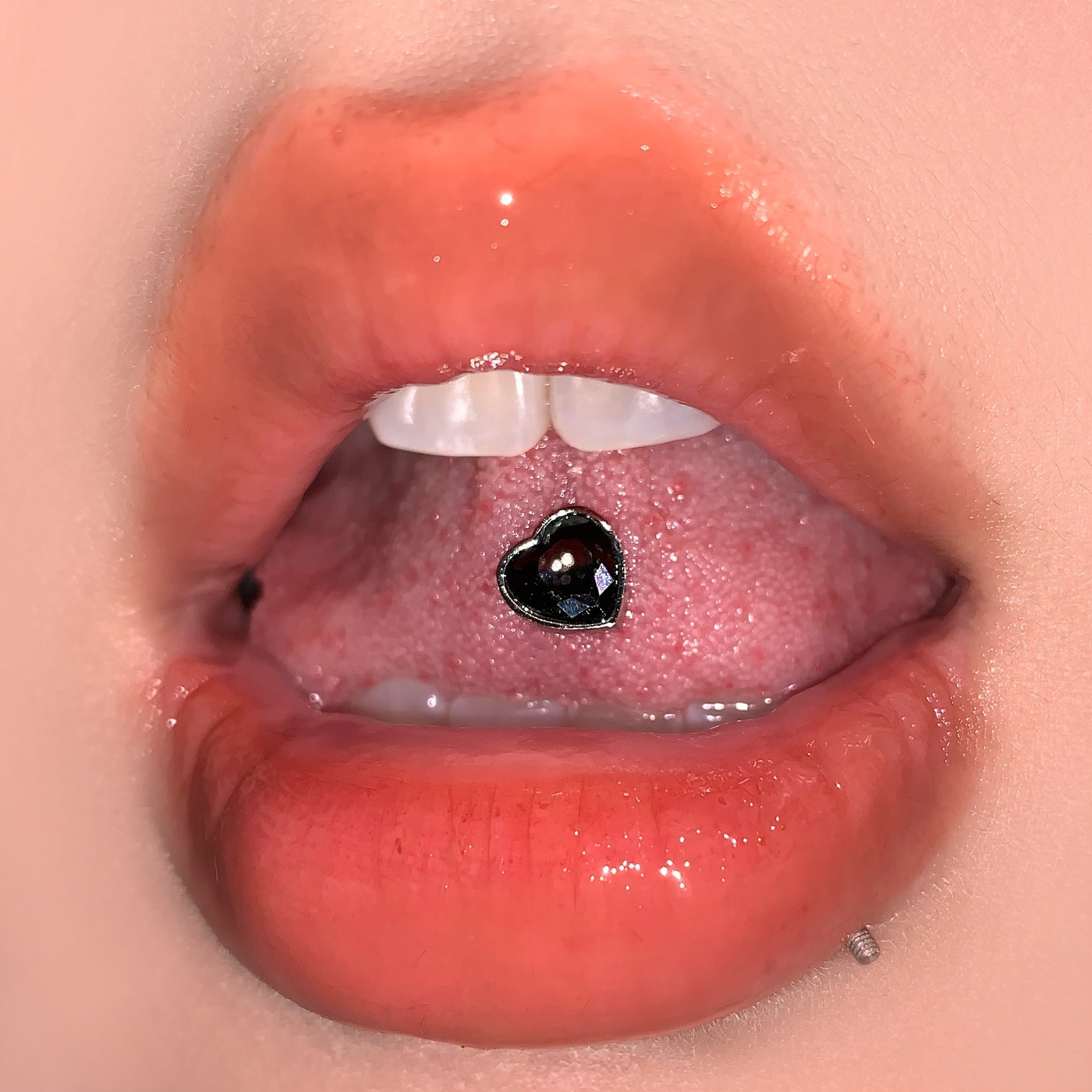 Silver pointed spike labret stud material detail