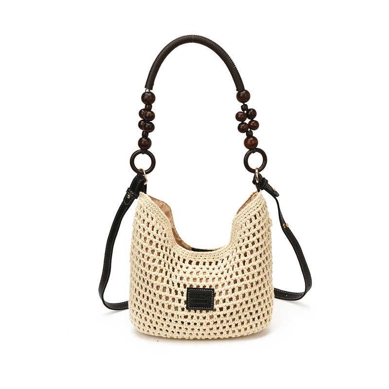 Bolsas de gran capacidad de tejido hueco para mujeres 2026 nuevas bolsas de playa de vacaciones en la playa de viaje nicho brazo Tote image 10
