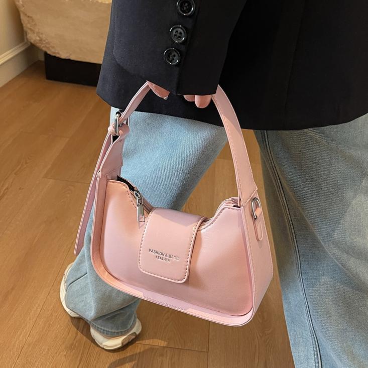 Nicho Zhong simple y versátil bolso de brazo para mujeres 2025, nuevo estilo de moda casual bolso de hombro de alta sensación bolso de media luna de mano