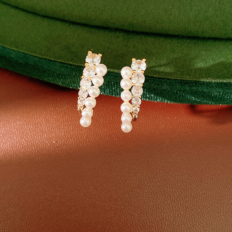 Agujas de plata de piedra de perla redonda perlas temperamento simple estilo estilo amplio pendientes ligeros de lujo alta sensación auriculares al por mayor