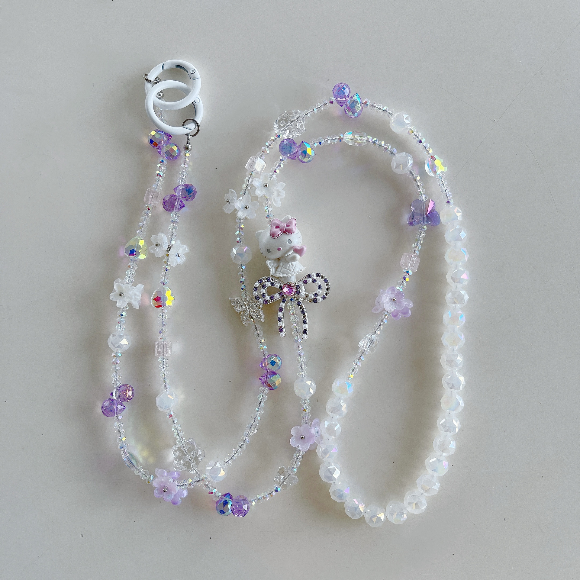 Boutique hecho a mano de alta gama para teléfono móvil cadena larga de gato KT lindo femenino cordón de teléfono móvil de moda colgante de mensajero largo