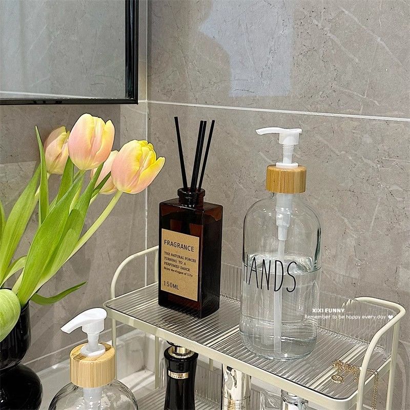Gran volumen de vidrio nórdico envasado botellas vacías de baño desinfectante de manos gel de baño champú de presión en el lavabo de aire