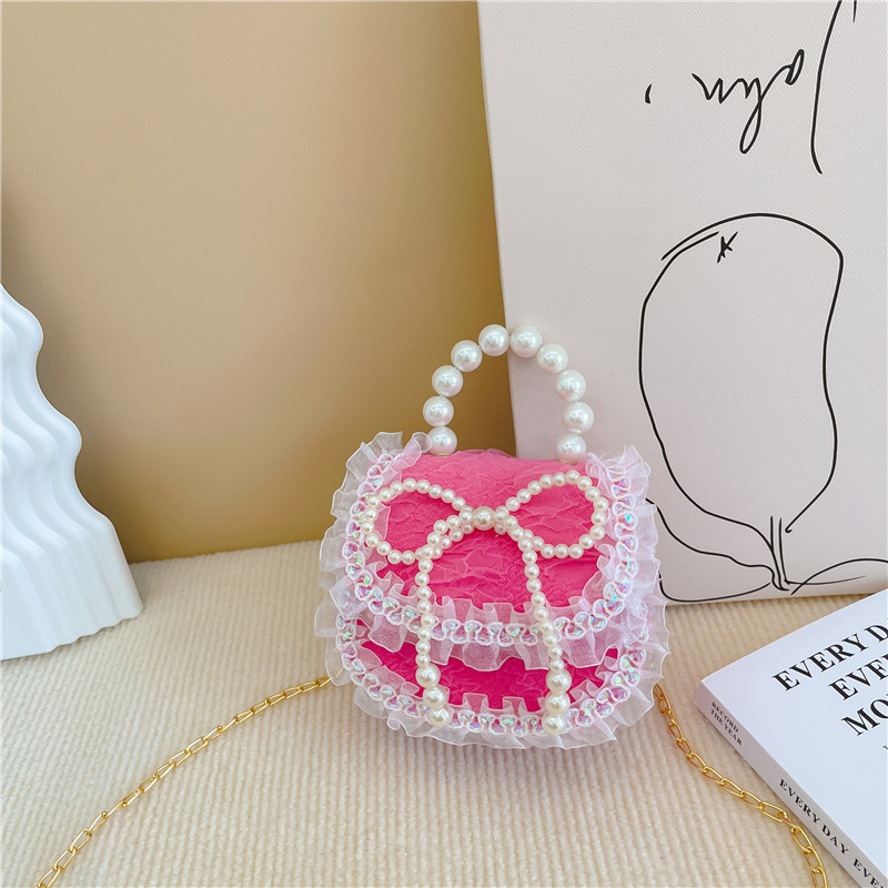 2022 nuevas niñas bolso de perlas de dibujos animados lindo arco princesa bolso de hombro estilo occidental encaje pequeño bolso de hombro