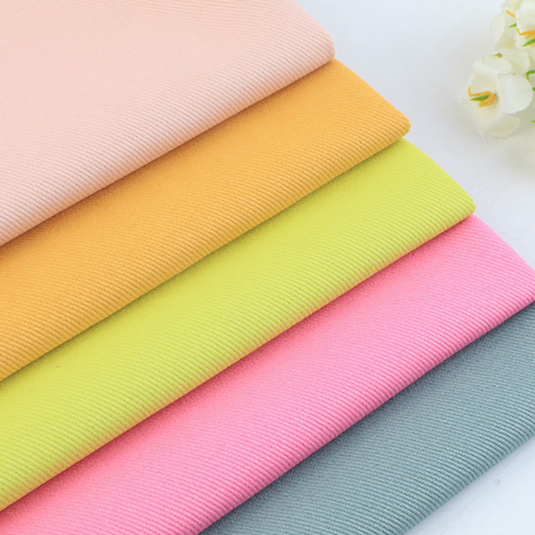 Color 10 * 10s 260gsm teñido de tejido de algodón grueso de hombre de algodón de tela de twill pantalones